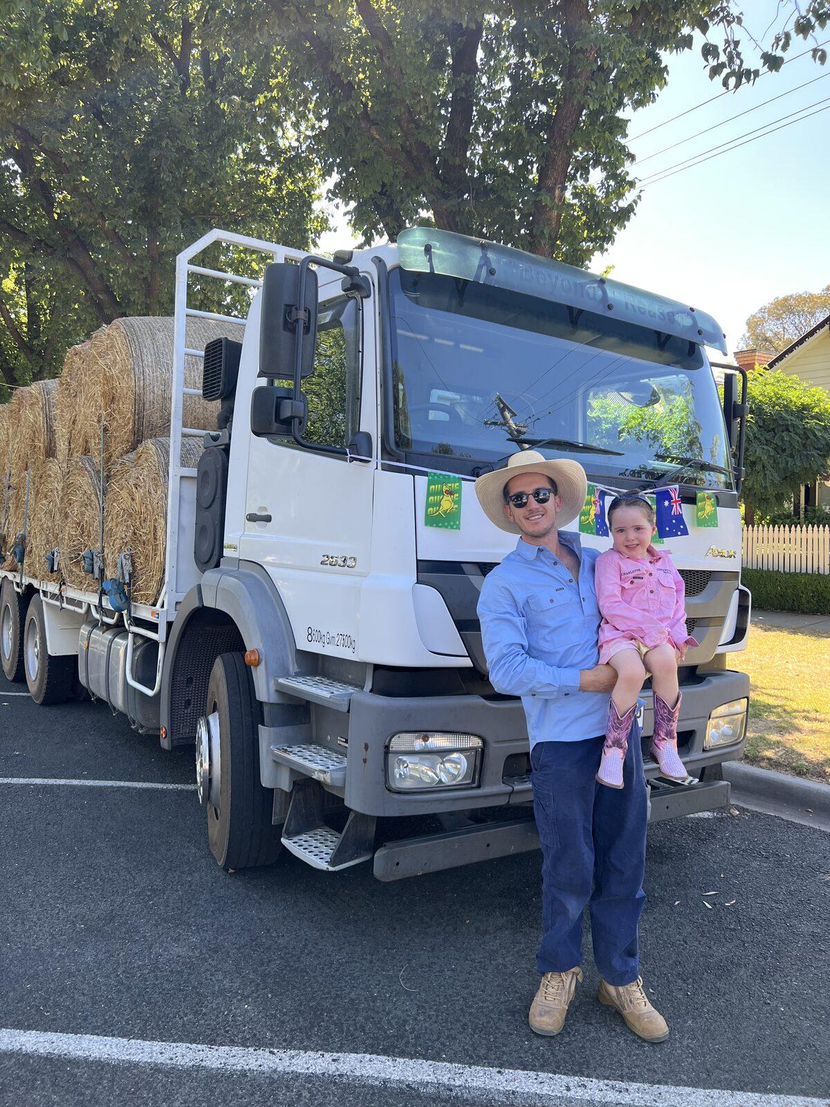 Will and his daughter on the truck, the family behind Farm Direct Stock Feeds