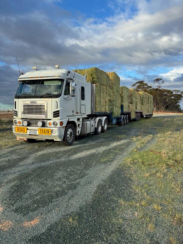 A Farm Direct road train loaded with hay, ready to deliver across Australia